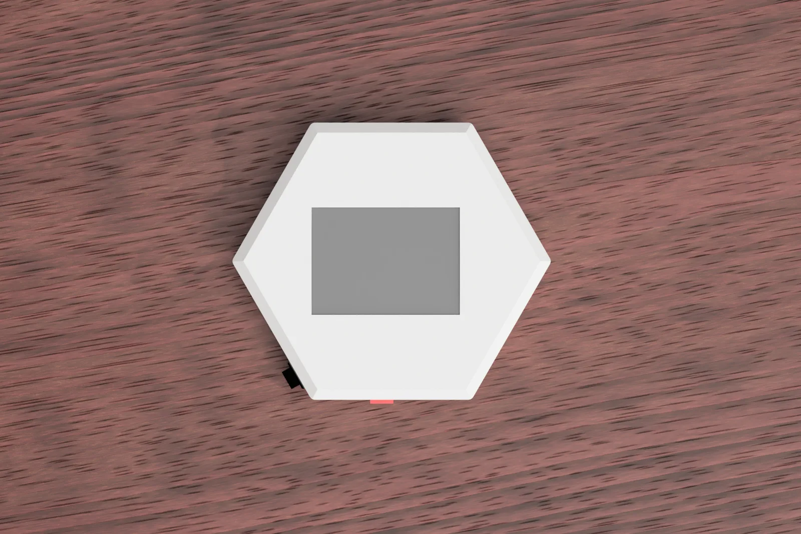 Top-down view of the Nimbus device showing its hexagonal shape and screen.